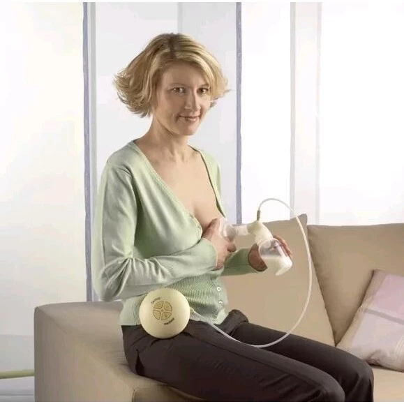 MEDELA Swing - 2 fázová elektrická odsávačka včetně Calma systému - Maminka odsává